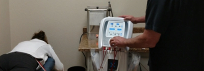 Chiropractor Reno NV Tom Waldorf With Electrical Muscle Stimulation Patient